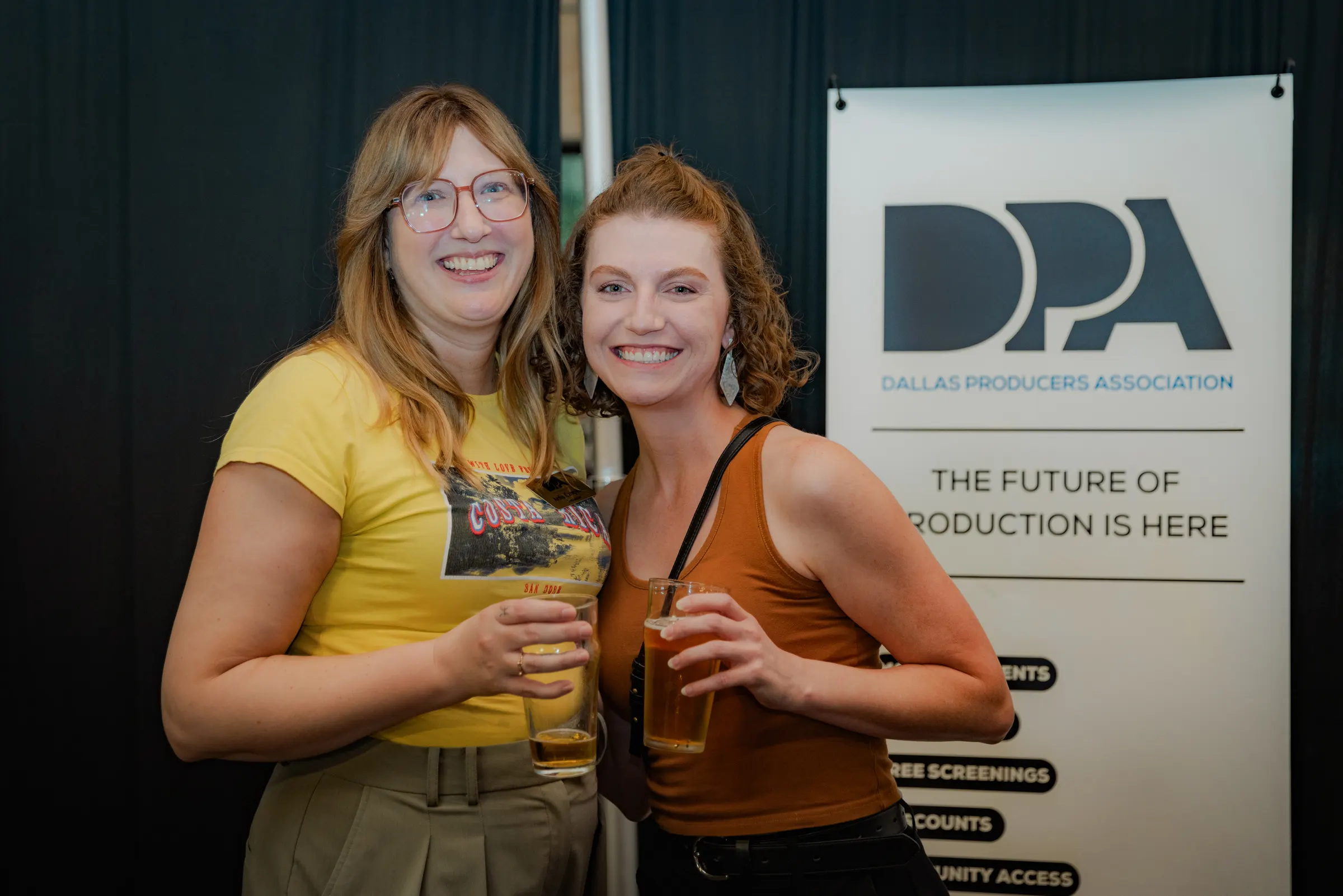 Two friends at the Dallas Producers Association table