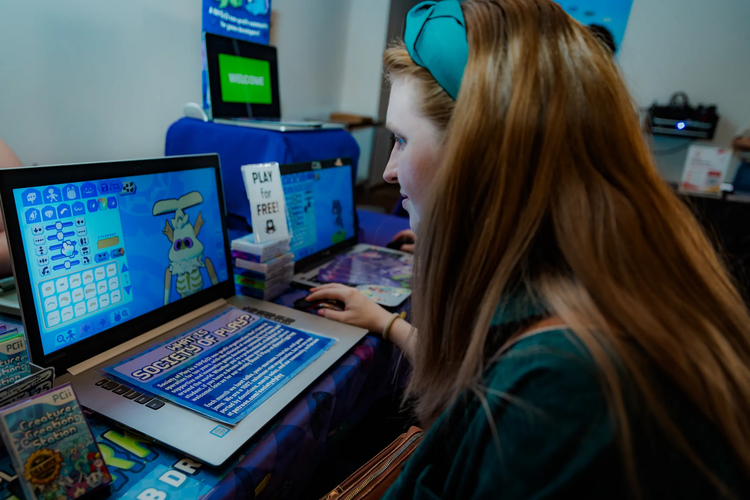 An attendee trying out a video game at a table