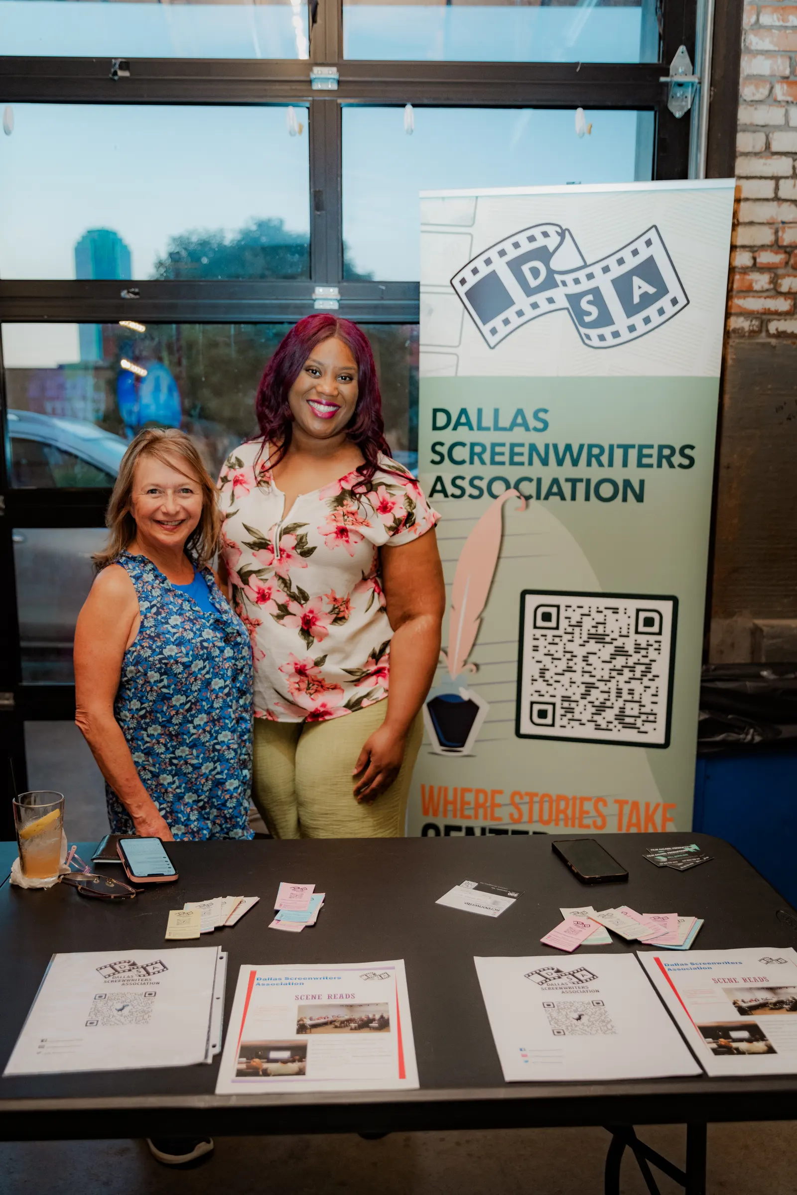 Two women at the Dallas Screenwriters Association table
