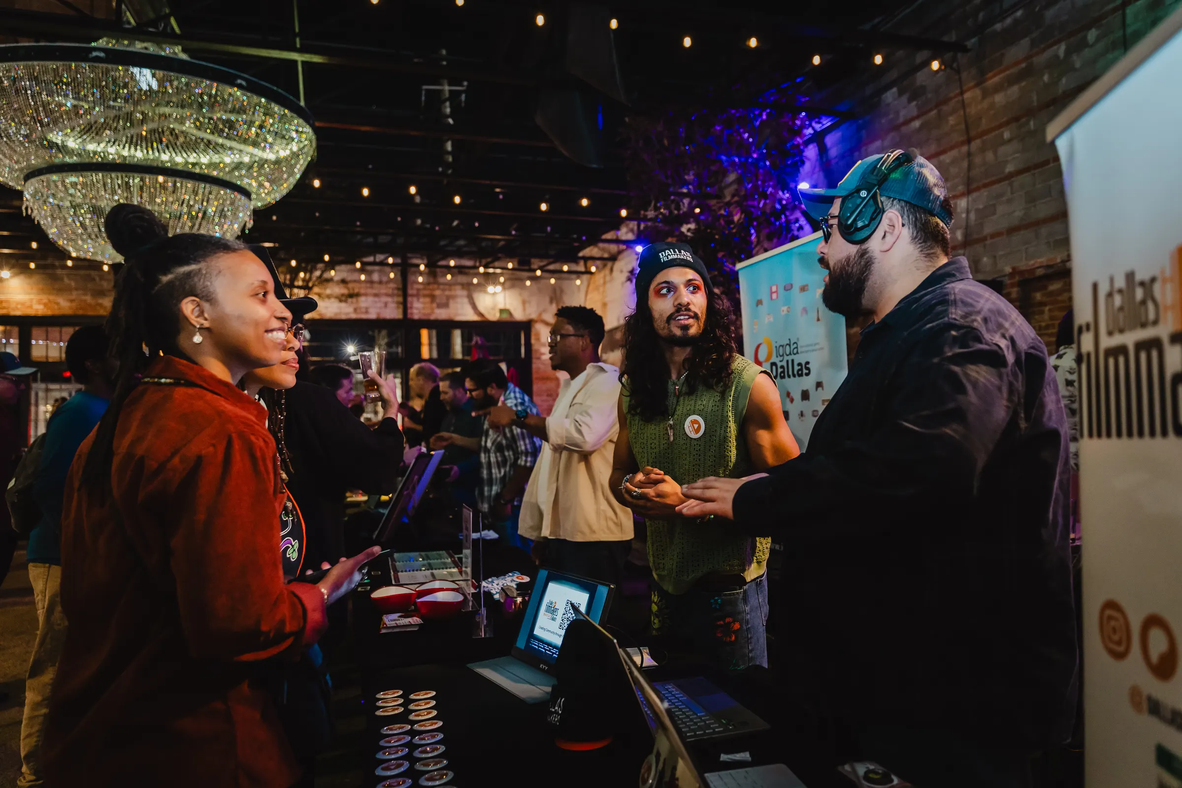 Creatives mingling around the tables at the first Hangout